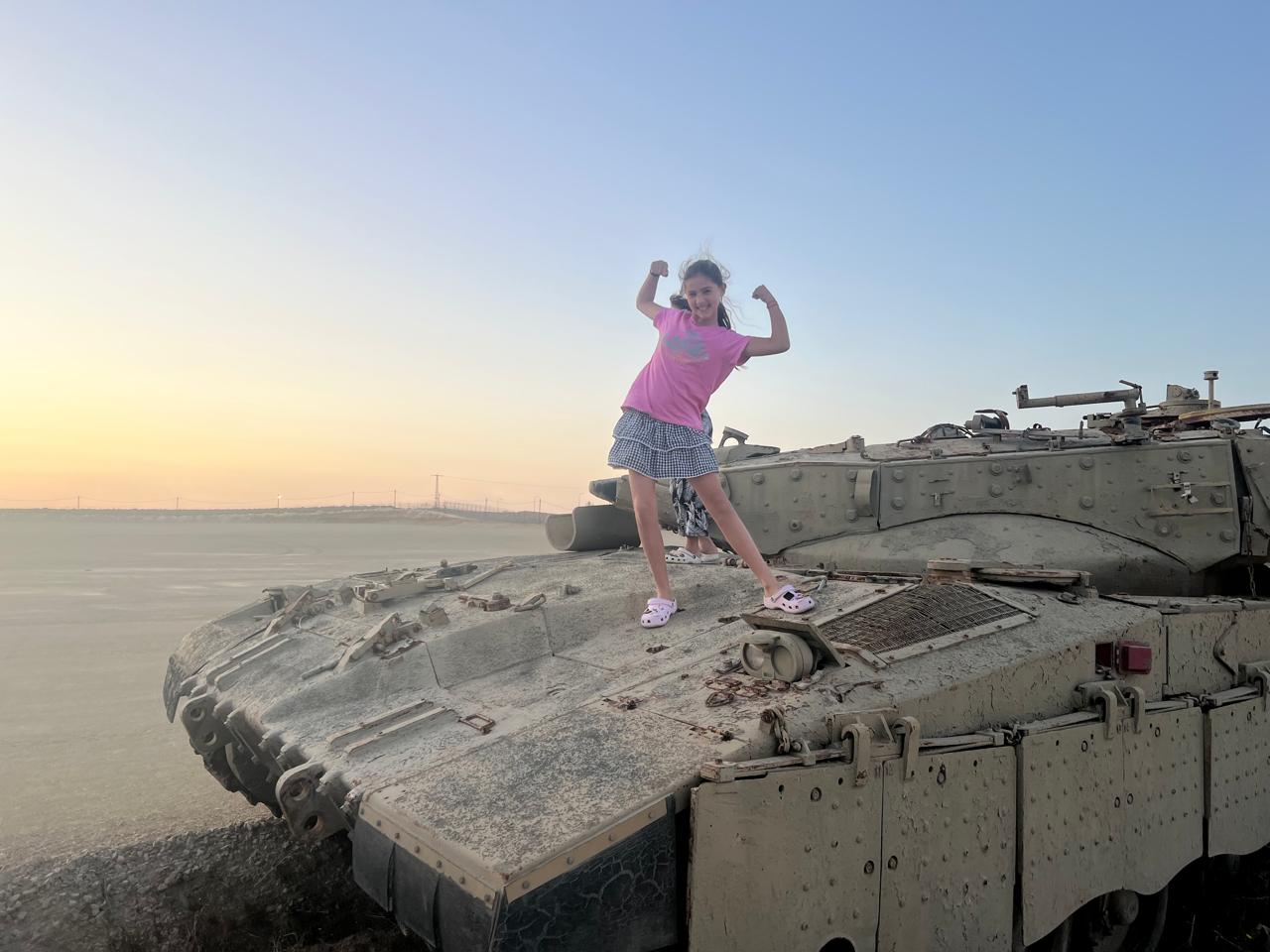 Mica being adventurous on a tank