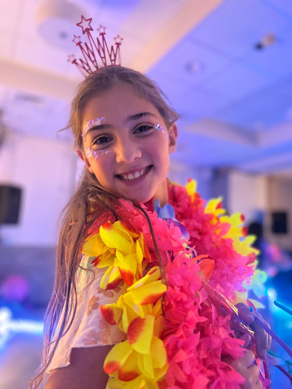 Mica all glammed up with a tiara and lei