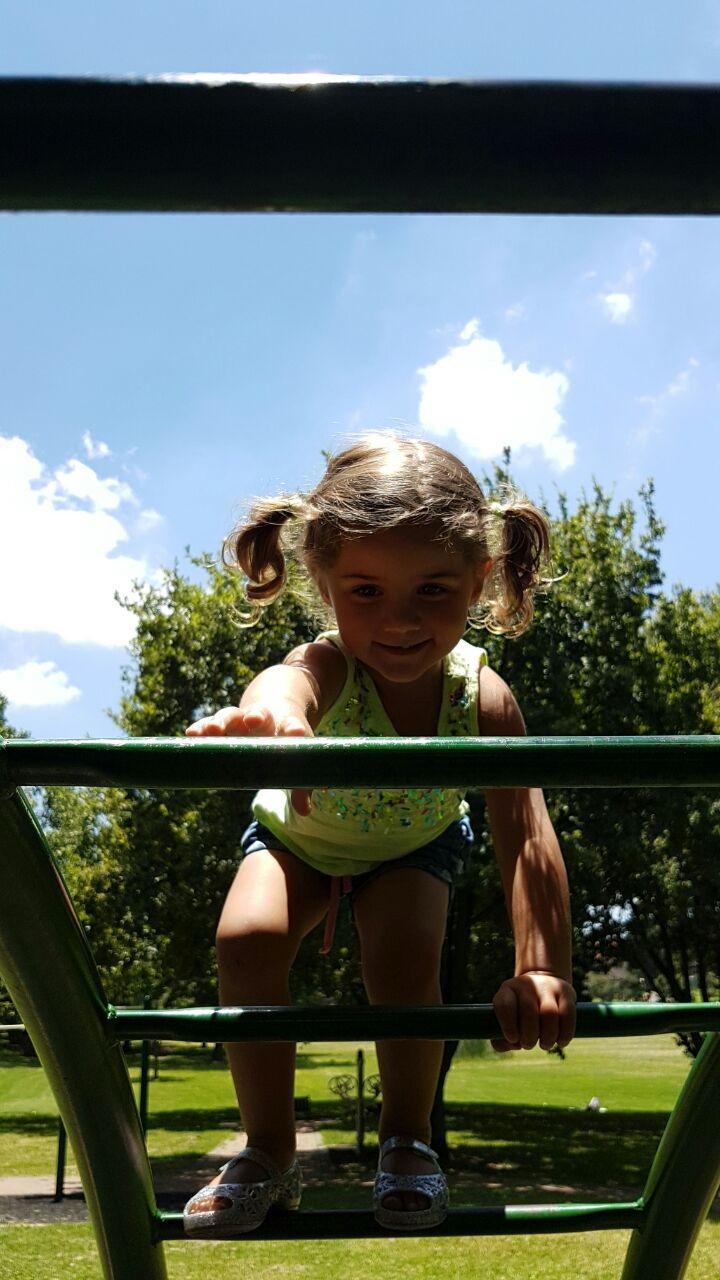 Mica climbing on the jungle gym