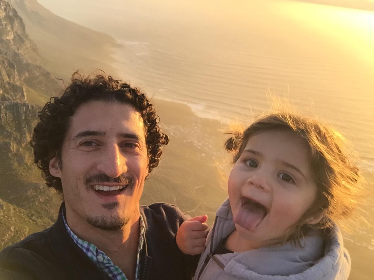 Mica pulling a silly face at sunset with Dad