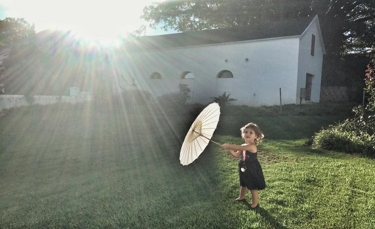 Mica with a parasol in golden light