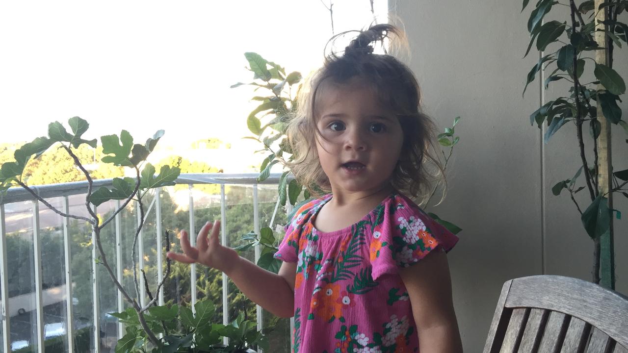 Mica with messy hair on the balcony