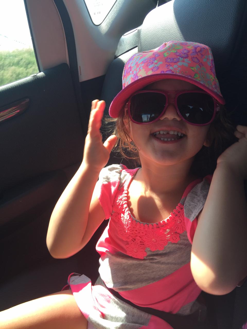 Mica being cool in shades and a floral cap