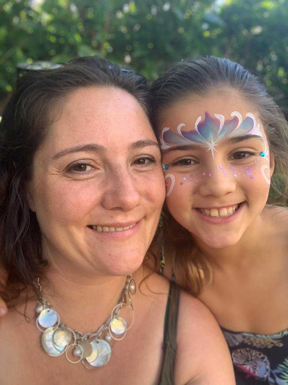 Mica with sparkly Frozen face paint and Mom